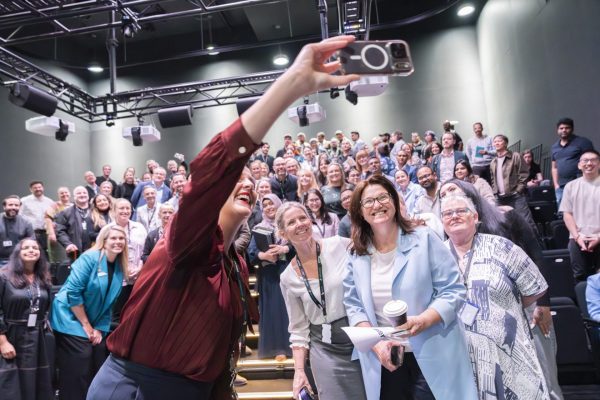 Group selfie at a staff Town Hall