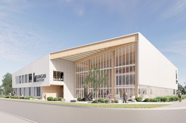 Design of exterior Melton Campus with Kangan Institute logo on the building facade and in the landscaped courtyard entrance. Glass walls overlook into training spaces.