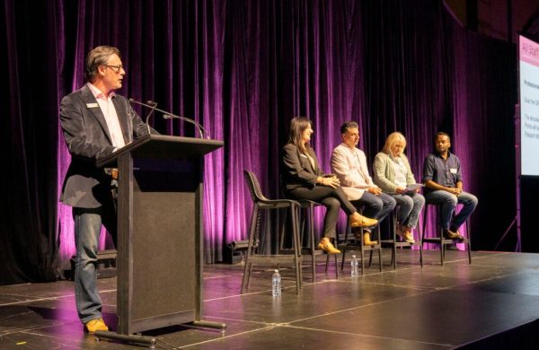 People doing a panel on a stage