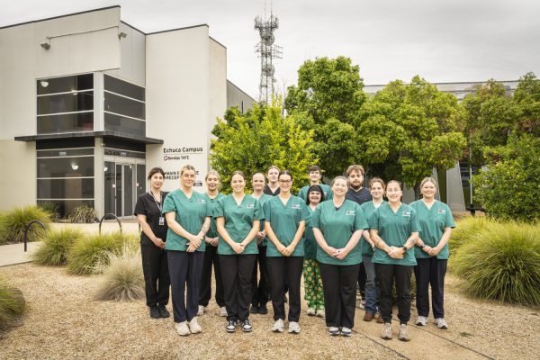 Nursing students in front of campus outdoors