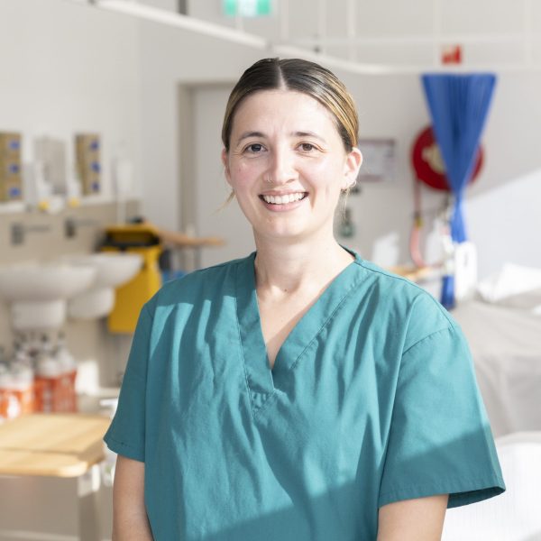Claire smiling to camera in hospital training setting