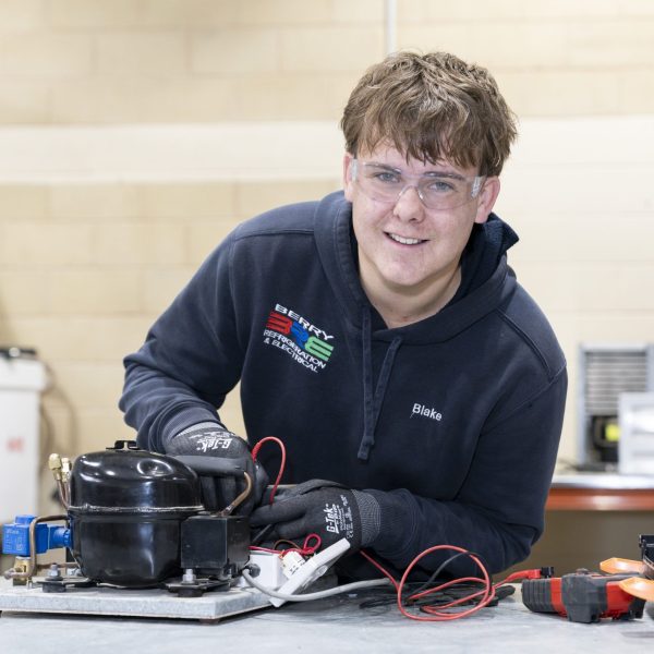 Blake with tools in workshop
